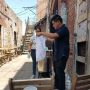 Robert and Zaida teaching how to brew